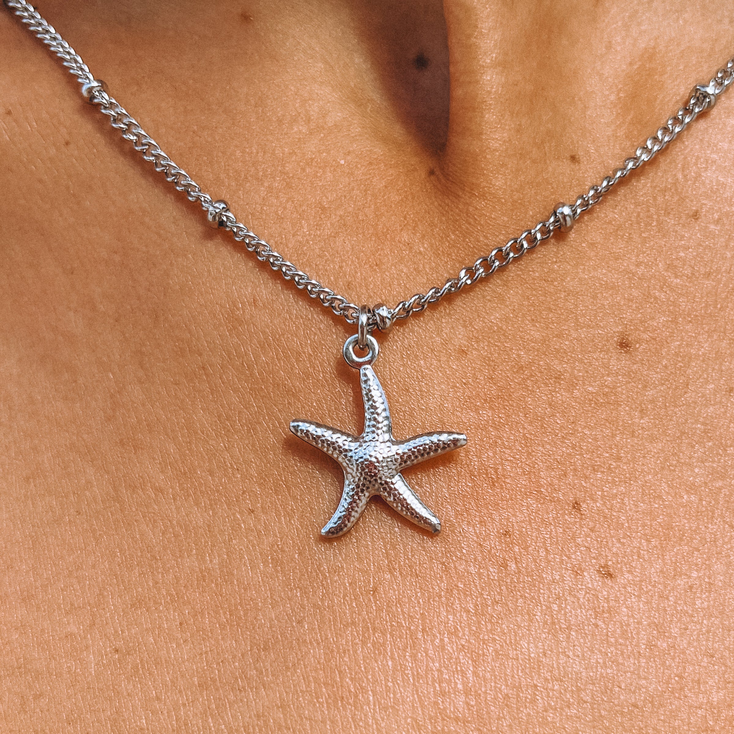 Silver star fish necklace