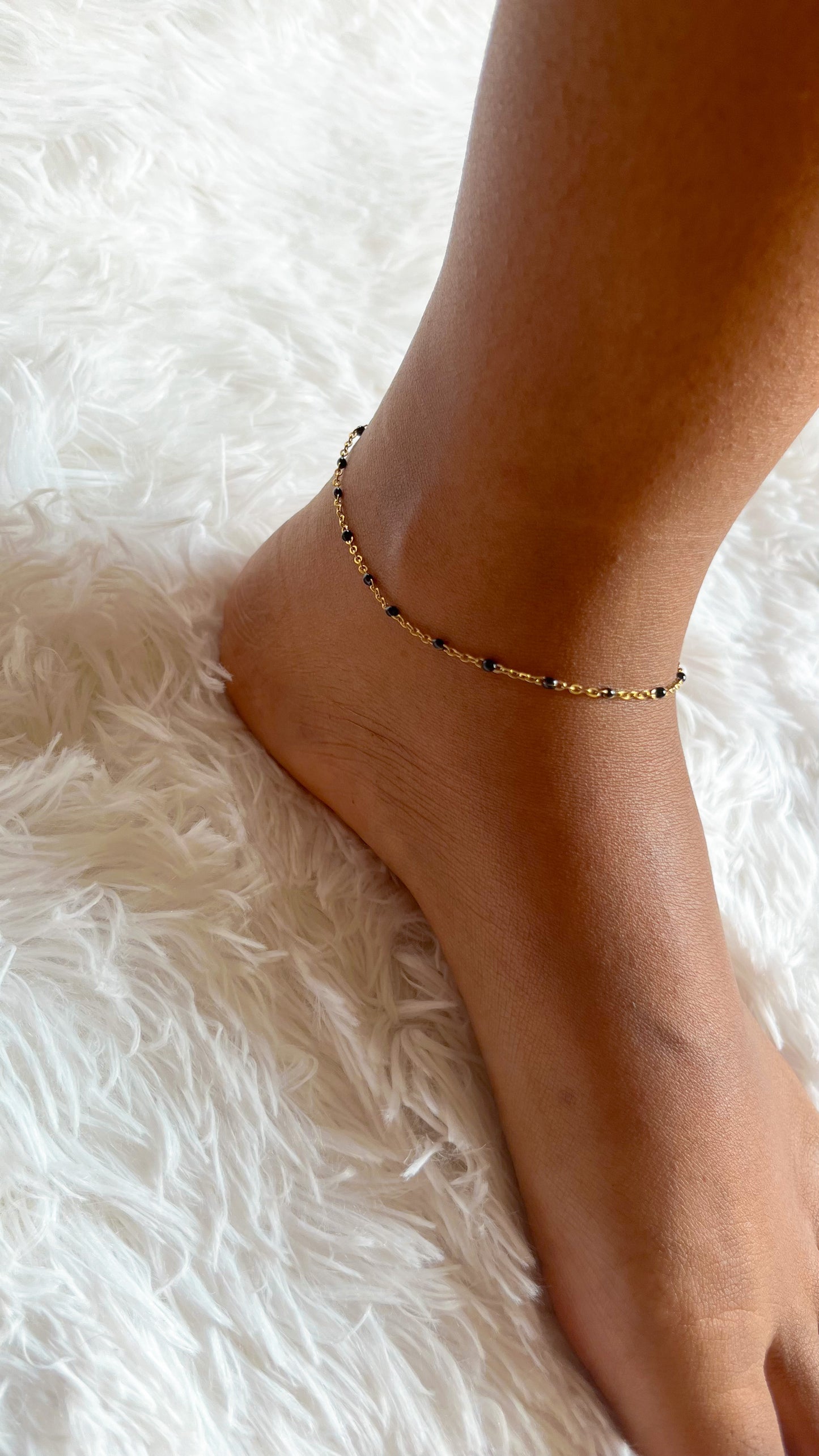 Black beaded golden anklet
